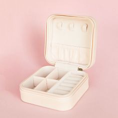 Whether something old or something new, you can securely transport your most treasured jewelry with this compact case, this is perfect for honeymoons! Carefully designed with multiple compartments, ring cushions, earring hooks, and an elastic pocket, this travel jewelry case protects your trinkets and delivers peace of mind. Multiple compartments Cushioned Color: blush pink Wipe to clean Compact Portable Cases For Storage, Compact Portable Storage Cases, White Rectangular Cosmetic And Toiletry Storage Gift, Rectangular White Cosmetic And Toiletry Storage Gift, Adjustable Rectangular Jewelry Storage For Travel, Compact Portable Jewelry Storage For Gift, Portable White Cases For Gift, Bride Squad Swimsuit, Squad Swimsuit