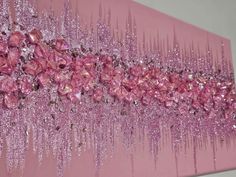 a pink painting with lots of crystals on it