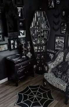 a black and white living room with spider web rugs on the floor, halloween decorations