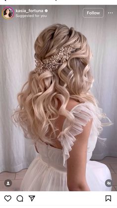 the back of a woman's head with long blonde hair and a tiara