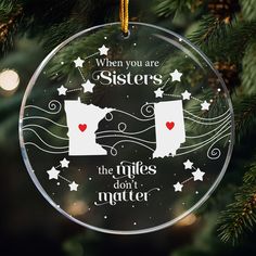 a glass ornament that says when you are sisters, the rules don't matter