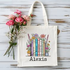 Carry your favorite reads in style with this personalized boho floral book tote bag. Customizable with your name, this tote features a charming bookshelf design adorned with beautiful flowers. Perfect for bookworms and readers, it's an ideal gift for book lovers. Durable and spacious, this tote bag is great for library visits, book club meetings, or everyday use. Add a touch of floral elegance to your book-carrying routine. Ideas for spine titles (limit of 7): - Favorite books - Profession and a Book Spines, Book Club Meeting, Routine Ideas, Tote Bag Custom, Sunday December, Book Spine, Book Tote Bag, Bookshelf Design, Artist Album