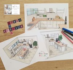 three drawings of a kitchen on top of a wooden table