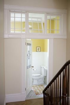 an open door leading to a bathroom with a toilet