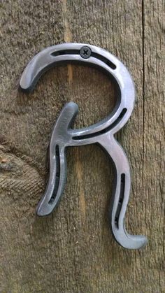 a metal object on the side of a wooden wall