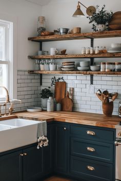 the kitchen is clean and ready to be used for cooking or baking, with shelves above the sink