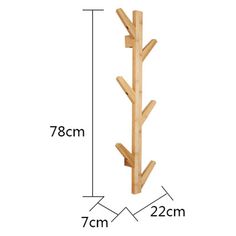 a wooden coat rack is shown with measurements for the top and bottom branches on it