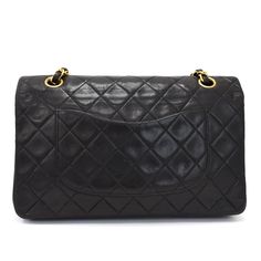 The Vintage Chanel Classic Double Flap Shoulder Bag, sized medium and crafted in sumptuous black lambskin, is an embodiment of timeless luxury and high fashion. This iconic accessory showcases the very essence of Chanel with its meticulously quilted leather, which feels as good as it looks. Its shiny black exterior, juxtaposed with gold-tone hardware, presents an aura of sophistication and elegance that transcends trends. The signature interlocking CC turn-lock closure opens to a burgundy leathe Gucci Watch, Versace Watch, Jimmy Choo Sunglasses, Flap Shoulder Bag, Timeless Luxury, Quilted Handbags, Fendi Shoes, Dior Shoes, Black Exterior