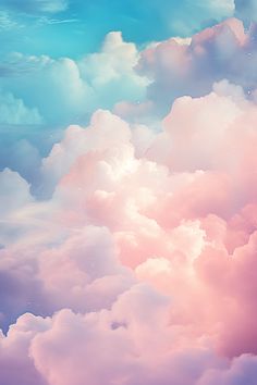 the sky is filled with pink clouds and bright blue skies, as seen from above