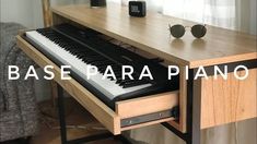 a piano sitting on top of a wooden table