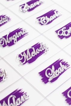 purple and white name stickers with silver lettering