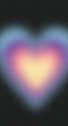 a heart shaped object is shown in the dark