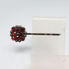 This neat older rhinestone accented hair or bobby pin is in excellent condition in black metal.  The length of the pin measures 2 5/8th  inches long by 3/4ths  inches high at the red rhinestone end .  The red rhinestones have a deep cherry red color . The hair pin in excellent condition and would work for an adult or a child.  We will send this to you in a lovely gift box for easy gift giving.  It is a lovely touch of color for your hair! If you like vintage hair accessories, old silver, vintage Cherry Red Color, Vintage Hair Accessories, Bobby Pin, Vintage Gothic, Vintage Hair, Red Rhinestone, Hair Pin, Vintage Hairstyles, Vintage Costume Jewelry