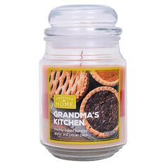 grandma's kitchen jar candle with cookies and pies on the lid, made from glass