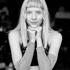 a black and white photo of a woman with blonde hair