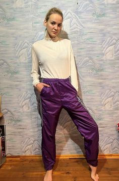 Vintage Purple Running Pants with Lining High Waist Colorful Breakaway Windbreaker Track Pants Running Trousers Size Large to Extra Large Label size: XL Estimated size: L-XL Measurements: (lying flat): Length: 44" / 112 cm Waist: 15,5" / 40 cm  (elastic) Hips: 23" / 59 cm Pant leg inseam: 31,5" / 80 cm * measurements taken while garment lay flat, to get girth you need to double measurements. Please check measurements to insure a proper fit. Remember to allow yourself some extra room for movement Retro Stretch Pants For Streetwear, Retro Stretch Bottoms With Pockets, Purple Sweatpants With Elastic Waistband, Athleisure Purple Pants With Pockets, Sporty Spring Harem Pants With Elastic Waistband, High Waist Purple Pants For Streetwear, Purple High Waist Pants For Streetwear, Purple Wide Leg Bottoms For Streetwear, Purple Sweatpants With Pockets For Spring