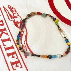 Blur Damon Albarn Inspired Glass Bead Necklace Retro Brown Handmade Necklaces, Retro Handmade Brown Necklaces, Handmade Retro Brown Necklaces, Vintage Adjustable Necklaces With Colorful Beads, Retro Necklace With Large Beads For Gift, Retro Colorful Beads Jewelry For Making, Retro Colorful Beads Jewelry For Jewelry Making, Retro Wooden Bead Jewelry, Retro Wooden Round Bead Jewelry