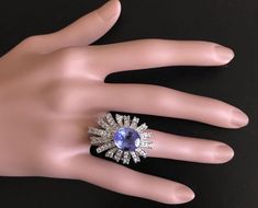 7.00 Carats Natural Very Nice Looking Tanzanite and Diamond 14K Solid White Gold Ring Suggested Replacement Value: Approx. $8,500.00 Total Natural Oval Cut Tanzanite Weight is: Approx. 5.00 Carats Tanzanite Measures: Approx. 12.00 x 10.00mm Natural Round Diamonds Weight: Approx. 2.00 Carats (color G-H / Clarity SI1-SI2) Ring total weight: Approx. 10.0 grams Disclaimer: all weights, measurements and colors are approximate and may vary slightly from the listed dimensions or as seen in the image. A Luxury Gia Certified Jewelry For Evening, Formal Baguette Cut Multi-stone Sapphire Ring, Baguette Cut Multi-stone Sapphire Ring For Formal Events, Baguette Cut Multi-stone Sapphire Ring For Formal Occasions, Formal Multi-stone Baguette Cut Sapphire Ring, Fine Jewelry Sapphire Ring For Party, Formal Multi-stone Diamond Sapphire Ring, Formal Multi-stone Sapphire Ring With Diamonds, Formal Multi-stone Sapphire Ring With Cubic Zirconia