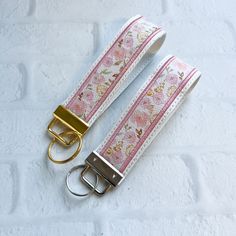 Cherry Blossom Vegan Leather Wristlet Keychain Key chain, Bridesmaid Gift Idea Gifts Under 20 For Her, Wristlet key fob, lanyard fob You are purchasing ONE wristlet keychain as shown in the photos above.  Designed with a combination of vegan leathers, this wristlet features an appliquéd center that can be monogrammed or personalized for an additional fee.   This wristlet is 5x1.25" not counting the hardware.   Due to the nature of the different vinyls, pattern placement will vary.  No two are ex Wrist Lanyard Aesthetic, Wristlet Keychain Ideas, Aesthetic Keys, Key Chains Aesthetic, Car Keychain Aesthetic, Leather Wristlet Keychain, Chains Aesthetic, Beach Keychain, Backpack Essentials