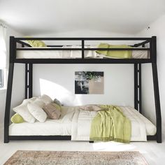 a black bunk bed sitting in a bedroom next to a rug and window with white walls