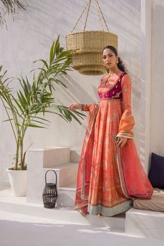 Dainty and delicate, feel like a dream in coral shaded layers of this printed khaddi silk peshwas with an attached handworked velvet bodice. The printed organza dupatta completes the look. Orange Tussar Silk Anarkali Dupatta, Orange Anarkali Tussar Silk Dupatta, Transitional Pink Anarkali Lawn Suit, Designer Pink Tussar Silk Anarkali Set, Designer Organza Dupatta In Orange, Designer Wear Orange Organza Dupatta, Designer Orange Organza Dupatta, Designer Tussar Silk Lawn Suit With Dupatta, Chanderi Lawn Suit With Sheer Dupatta For Transitional Season