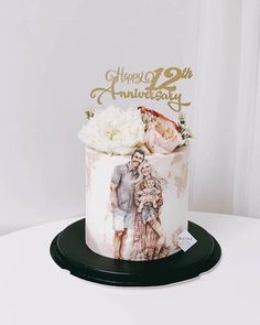 a wedding cake with an image of two people on it