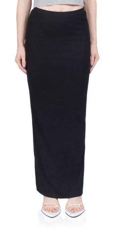 Expertly crafted by ETERNE, the Emma Butter Rib Skirt offers a timeless and flattering silhouette. Made from a luxurious blend of rib cotton and modal, this skirt is both buttery soft and lightweight. The elastic waistband and back hem slit provide comfort and ease of movement. Elevate your wardrobe with this classic piece. Details: Color: Black 48% cotton, 48% modal, 2% spandex Pull on style, elastic waistband Slit at back hem Vendor Code: CB201-04 Fits true to size Model is 5ft 5in and is wearing a size S Chloe Bartoli, Rib Skirt, Ribbed Skirt, Women's Wardrobe, Skirt Black, Designer Outfits Woman, Long Skirt, Butter, Spandex