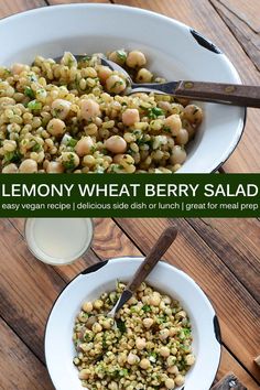 lemony wheat berry salad in a white bowl on a wooden table with spoons