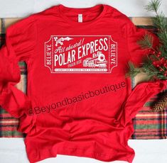 Adult Polar Express Shirt - Polar Express Shirt - Polar Express Shirt - Adult Christmas Shirt - Christmas Shirt This is a super adorable Adult Polar Express Ticket Shirt. Perfect for your visit with Santa, Christmas Eve, Polar Express Train Ride or School. Match with the Kids. Made with Heat Transfer Vinyl. This is a unisex fit shirt made with 100 % Cotton. Please check measurements before ordering. Please be aware we are not responsible for sizing errors. We love custom orders. Just message us! Polar Express Cricut Shirt, Polar Express Ticket, Movies Ideas, Polar Express Tickets, Believe Polar Express, Polar Express Train Ride, Kids Christmas Shirt, Polar Express Train, Christmas Shirts For Kids