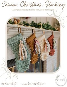 crocheted christmas stockings hanging from a fireplace mantle with text overlay that reads, camera christmas stocking an original crochet pattern by beth