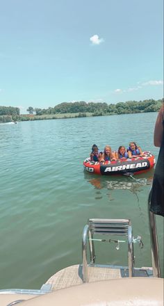 a group of people on a boat in the water