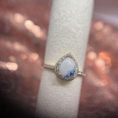 a close up of a ring on a napkin