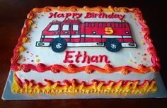 a birthday cake with a fire truck on it