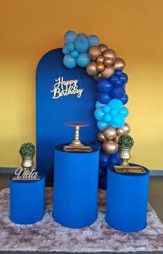 blue and gold birthday decorations with balloons