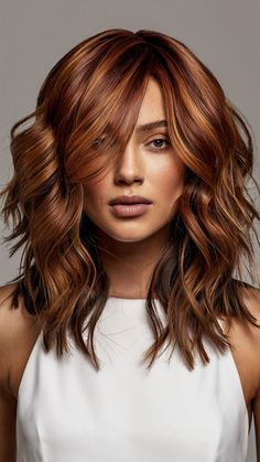 The Caramel Mushroom Brown hair color adds a touch of warmth and richness to the classic mushroom brown by incorporating caramel highlights. This color is perfect for those who want to add a bit of warmth and depth to their hair while still maintaining a cool, earthy base. The caramel tones create a beautiful contrast that enhances the overall dimension of the hair. Copper And Auburn Highlights, Hair Colors For Dark Brown Eyes, Caramel Highlights On Red Hair, Copper Highlights On Brown Hair Caramel, Auburn Medium Length Hair, Auburn Hair Color With Highlights Copper, Fall Ginger Hair, Cinnamon Spice Hair Color, Coffee Brown Hair Color