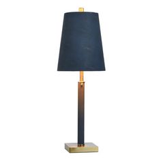 a black lamp with a gold base and a blue shade on the top, sitting on a white background