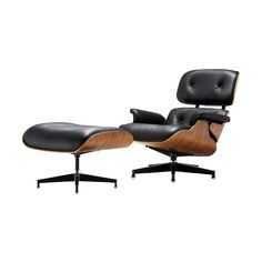 an eames lounge chair and ottoman in black leather