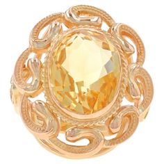 Size: 5 1/4 Sizing Fee: Up 2 sizes for $45 or Down 1 size for $45 Era: Retro Date: 1940s - 1950s Metal Content: 14k Yellow Gold Stone Information Natural Citrine Treatment: Heating Carat(s): 5.20ct Cut: Oval Color: Yellow Total Carats: 5.20ct Style: Cocktail Solitaire Theme: Floral Swirl Measurements Face Height (north to south): 31/32" (24.4mm) Rise Above Finger: 5/16" (7.3mm) Weight: 7.0 Grams Stamps: 14k Condition: Pre-Owned Retro Cocktail, La Face, Gold Stone, Solitaire Ring, Citrine, Metallica, Swirl, Jewelry Rings, Yellow Gold