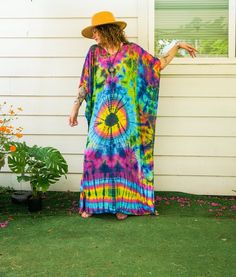 Add a touch of unique style to your wardrobe with our Hand-Dyed Kaftan Poncho Dress. This stunning loose-fit tie-dye dress is perfect for beachwear, loungewear, or any casual occasion. Made from premium rayon fabric and meticulously hand-dyed, each dress is a one-of-a-kind masterpiece that combines comfort, style, and artistic expression. Key Features * Unique Hand-Dyed Design: Each dress is carefully hand-dyed using a unique method, resulting in intricate patterns and vibrant colors. * Premium Material: Made from breathable and comfy rayon, ensuring maximum comfort all day long. * Handmade: Each dress is handmade with love and care, ensuring the highest quality and attention to detail. * Eco-Friendly Shipping: Ships from Texas, reducing the carbon footprint and ensuring faster delivery ti Flowy Multicolor Kaftan For Festival, Colorful Bohemian V-neck Kaftan, Multicolor Hippie Kaftan For Festivals, Hippie Multicolor Free Size Kaftan, Hippie Multicolor Kaftan For Summer, Multicolor Free Size Festival Cover-up, Bohemian Hand-dyed Festival Dress, Multicolor Relaxed Fit Maxi Dress For Summer, Hippie Multicolor Festival Cover-up