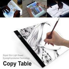 a person is drawing on a tablet with a pen