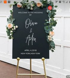 a welcome sign with flowers and greenery on it for an elegant wedding ceremony in chicago, illinois