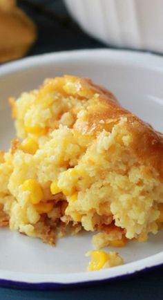 a close up of food on a plate with corn and bread crumbs in it