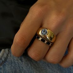 The one of a kind Round Sapphire Bezel Set Cloud Ring features a 1.45ct medium blue round Ceylon/Sri Lankan Sapphire in a 14k yellow gold cloud setting. The soft edges of the bezel perfectly compliment the soft dome cloud shape of the ring, making an ultra wearable future heirloom piece. Sapphire is the birthstone of September and a stone long associated with the skies and heavens. With all of its celestial hues, in medieval times sapphire represented hope and faith. Sapphires have also been thought to protect from evil, attract good blessings, wisdom, and symbolize truth. May this unique sapphire bring you all the hope, wisdom, and celestial vibes you need.Note - This item is final sale! Made in a size 7, can be resized up or down 2 sizes. Sapphire Bezel Ring, Gold Dome Ring, Flush Setting, February Birth Flowers, Cloud Ring, Cloud Shape, Bezel Engagement Ring, Soft Edges, Ring Making