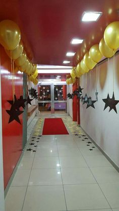 a hallway decorated with balloons and stars