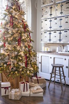 a christmas tree with presents under it