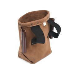 a small brown bag with a black handle