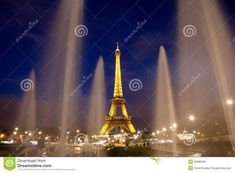 the eiffel tower lit up at night in paris, france stock photo - image