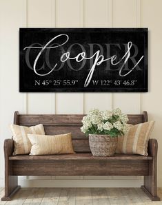 a wooden bench sitting in front of a wall with a sign that says coopers on it