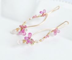 "Inspired by cherry blossom, Pink sapphire and Rose quartz earrings. Delicate yet unique, can be worn with pair of jeans or fancy dress. The earrings is represents beauty of cherry blossom, also strong presence. 14k gold filled, 20gauge ( 0.8mm thick) Pink sapphire, Peridot, Rainbow moonstone, Peridot, Pink tourmaline Total length of the earrings is approx 2\" (5.2cm) Come in a gift box Made to Order Chandelier version is here, https://www.etsy.com/listing/181287721/cherry-blossoms-earrings-pink Elegant Pink Jewelry Hand Wrapped, Elegant Pink Hand Wrapped Jewelry, Elegant Hand Wrapped Pink Jewelry, Cherry Blossom Jewelry, Earrings Japanese, Wedding Earrings Chandelier, Pink Sapphire Earrings, Japanese Jewelry, Pink Cherry Blossom