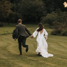 Romantic and ethereal portrait of bride and groom running hand in hand across the grounds of wedding venue Askham Hall, a hidden gem in the heart of the Lake District. 

Image James Green Bride And Groom Running, Ethereal Portrait, Country House Wedding Venues, Country House Wedding, Wedding Gift List, Lake District National Park, Couples Portrait, Wedding Barn, Barn Wedding Venue